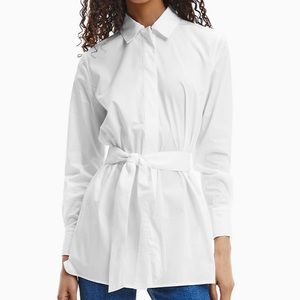 This is a white Calvin Klein blouse top